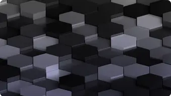 Nahaufnahme einer strukturierten Oberfläche mit einem Muster aus hexagonalen, grauen und schwarzen Blöcken.